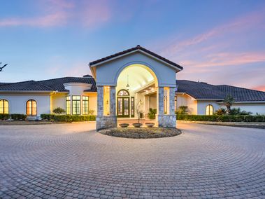 Exterior of luxury home located in West Lake Hills, TX during sunset